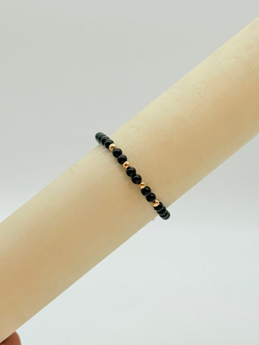 Black Glossy beads And Gold Beads Bracelet In 18K