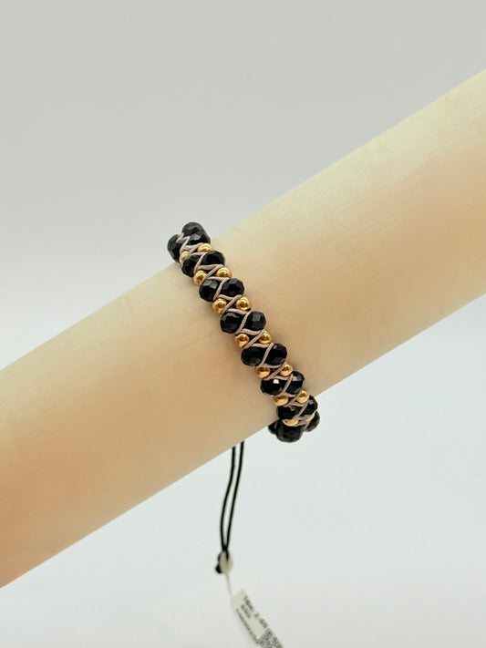 Glossy Black Faceted Beads With White Cord and Gold beads In Bracelet 18K